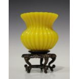 A Chinese Peking yellow glass vase, mark of Qianlong but possibly late Qing dynasty, of reeded