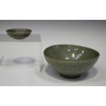 A Korean celadon glazed lotus bowl, Koryo dynasty, the exterior carved in relief with overlapping