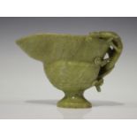 A Chinese archaistic carved soapstone libation cup, late Qing dynasty, the handle carved and pierced