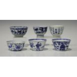 A group of six Chinese blue and white porcelain wine cups/tea bowls, 18th century, with variously