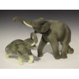 An Art Deco Vinsare Sèvres model of an elephant, 1940s, modelled with raised trunk, height 30cm,