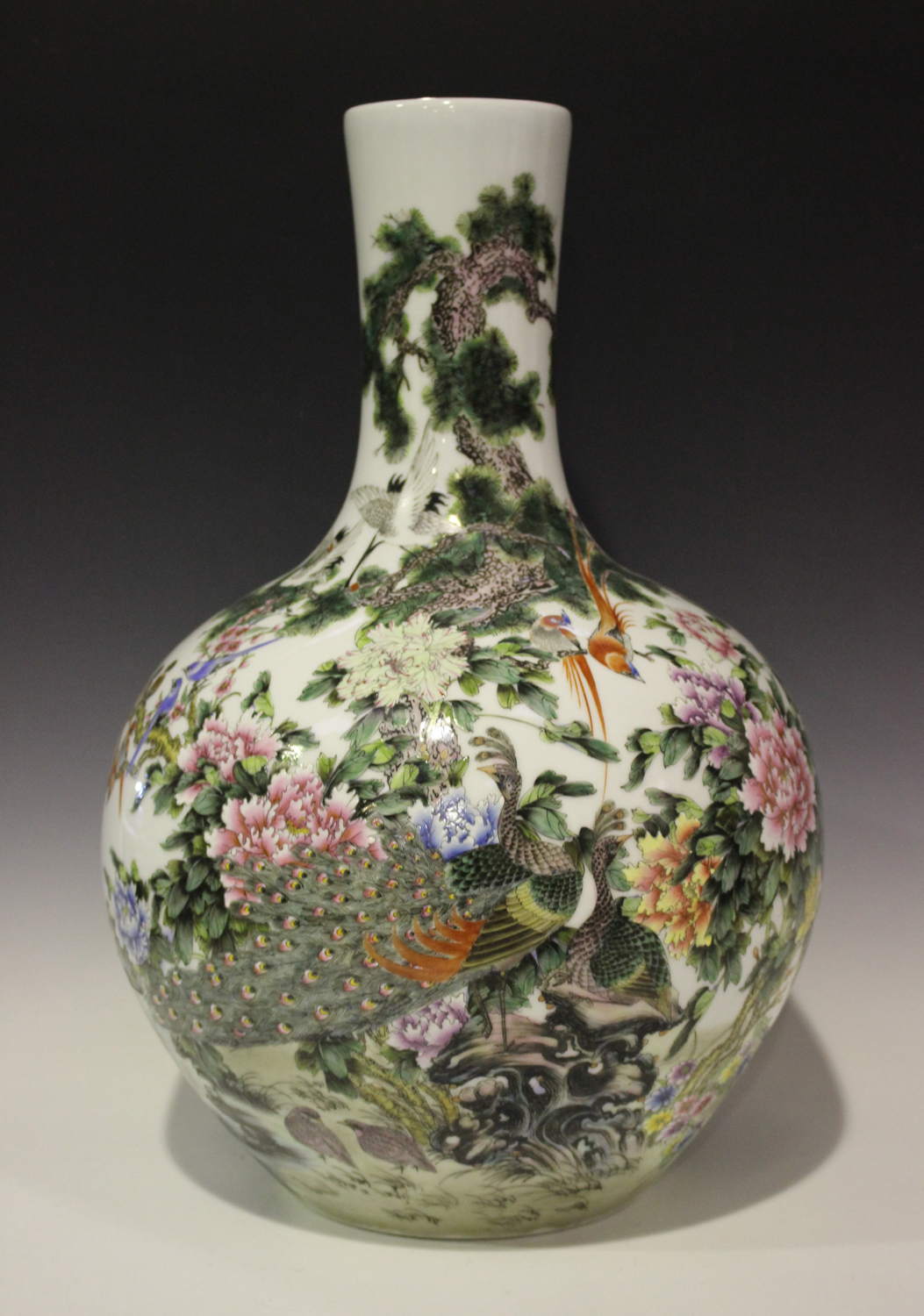 A Chinese famille rose porcelain bottle vase, modern, painted with an array of different birds