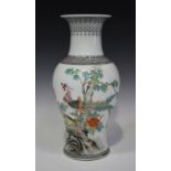 A Chinese famille rose porcelain vase, mid-20th century, of baluster form, painted with a pair of