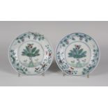 A pair of Chinese doucai porcelain circular saucer dishes, mark of Chenghua but Qing dynasty, each