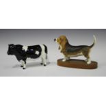 Two Beswick animals, comprising Friesian Bull, No. 1439A, and Bassett Hound, No. 2045B.Buyer’s