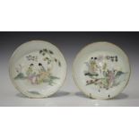 Two Chinese famille rose porcelain saucer dishes, Republic period, each painted with a figural scene