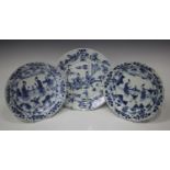 A pair of Chinese blue and white porcelain plates, Kangxi period, each centre painted with two