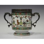 A Chinese famille verte porcelain footed cup, Kangxi period, with later mounted silver rim and a