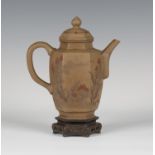 A Chinese brown Yixing stoneware teapot and cover, probably late Qing dynasty, the swollen hexagonal