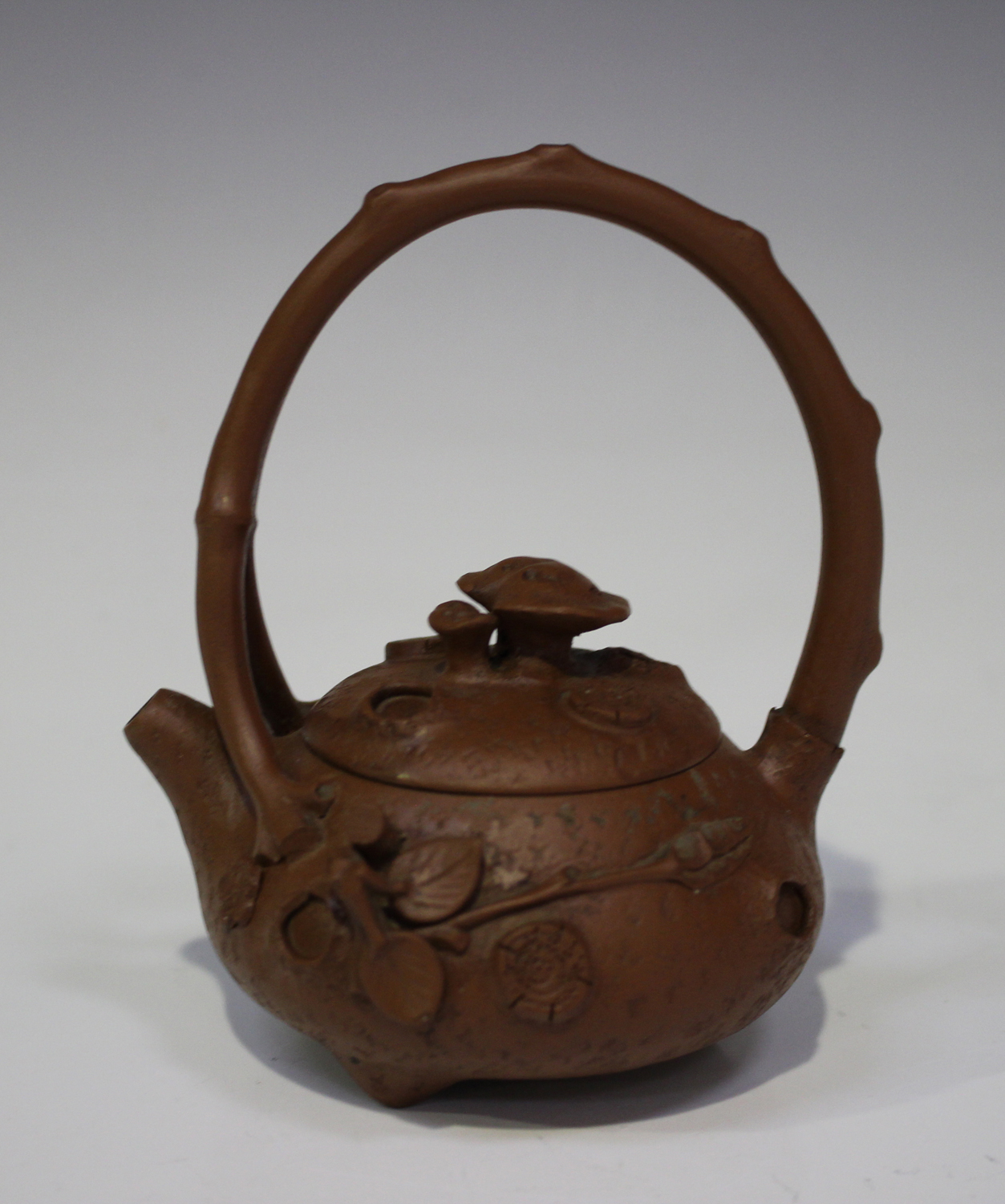 A Chinese Yixing stoneware teapot and cover, late 19th/early 20th century, the squat circular body