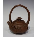 A Chinese Yixing stoneware teapot and cover, late 19th/early 20th century, the squat circular body