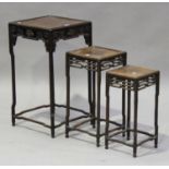 A Chinese hardwood occasional table, late 19th/early 20th century, the square panelled top above a