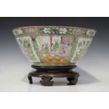 A Chinese Canton famille rose porcelain punchbowl, mid to late 19th century, the interior and