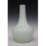 A Chinese white glazed porcelain bottle vase, Qing dynasty, probably 18th century, the compressed