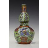 A Chinese 'clobbered' blue and white Kraak porcelain double-gourd bottle vase, Wanli period, the
