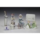 Four Lladro figures, comprising Harlequin, No. 5075, Sad Sax, No. 5471, Girl with Lamb, No. 4505,