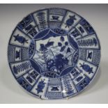 A Chinese blue and white Kraak style porcelain circular dish, Kangxi period, the centre painted with