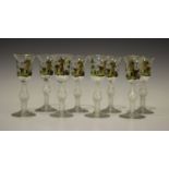 A set of eight Continental 18th century style wine glasses, each bell bowl polychrome enamelled with