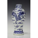 A Chinese blue and white porcelain baluster vase, late 19th century, painted with two dragons