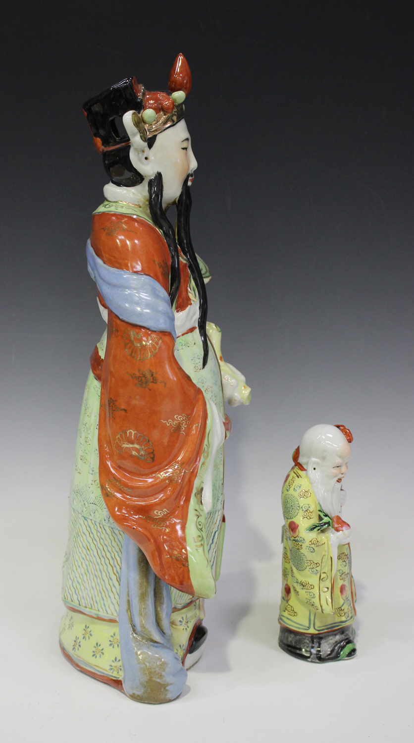 A Chinese porcelain figure of an immortal, mid-20th century, modelled standing wearing a long robe - Image 6 of 6