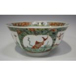 A Chinese famille verte porcelain circular bowl, Kangxi period, with gently everted rim, the