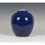 A Chinese blue glazed porcelain vase, mark and period of Qianlong, of stout ovoid form, covered in a