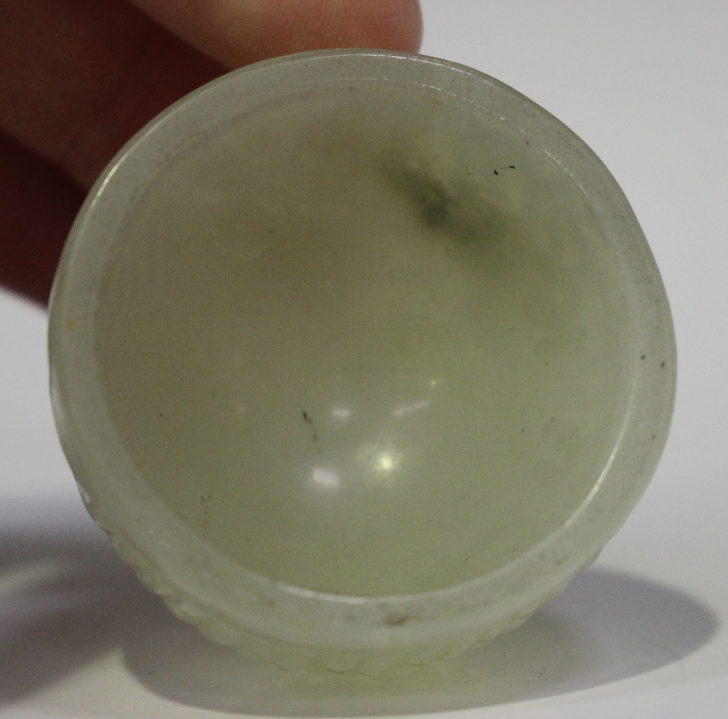 A Chinese small pale celadon jade wine or water cup, Qing dynasty, possibly 18th century, carved - Image 3 of 5