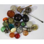 A collection of Chinese snuff bottle stoppers, mostly late Qing dynasty, including jade, agate, rock