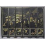 A Chinese lacquer six-fold screen, early 20th century, one side inset with soapstone and gilt with