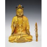 A Chinese giltwood figure of Buddha, 20th century, carved seated in dhyanasana wearing a long