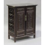 A Chinese lacquered softwood side cabinet, late Qing dynasty, the pair of hinged doors with