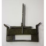 A Chinese brass and steel padlock and key, probably Qing dynasty, the lock constructed in two parts,