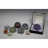 A Paul Ysart scrambled millefiori paperweight with nine suspended air bubbles, applied paper label