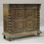 A 17th/18th century Continental walnut side cabinet, the moulded top above two drawers and four