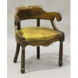 A French Empire mahogany tub back and scroll arm desk chair, the seat overstuffed and upholstered in