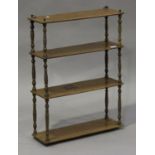 An early 20th century walnut four-tier hanging wall shelf with turned supports, height 74cm, width