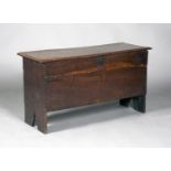 An unusual George II oak boarded coffer, the hinged lid indistinctly incised with a name and dated