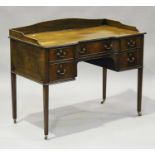 A 19th century mahogany inverted bowfront writing table, the galleried back above five drawers,