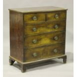 A George III mahogany chest of two short and three graduated long drawers, on bracket feet, height