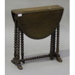 A Victorian mahogany oval 'baby' Sutherland occasional table, on bobbin turned legs, height 57cm,