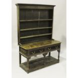 An 18th century oak dresser, the shelf back above two frieze drawers and an open pot shelf, on