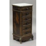 An early 20th century French rosewood narrow bedside chest of drawers, the white marble top above