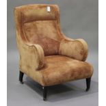 An Edwardian mahogany scroll armchair, upholstered in apricot velour, on square tapering legs and