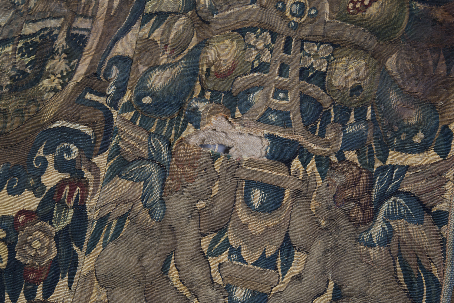 A Flemish tapestry border fragment, mid/late 16th century, probably Brussels, the central oval - Image 3 of 3
