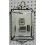 A late 19th/early 20th century Venetian sectional wall mirror, the scrolling surmount and borders