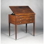 A late George III mahogany architect's table, the hinged top with ratchet strut and rail, the frieze