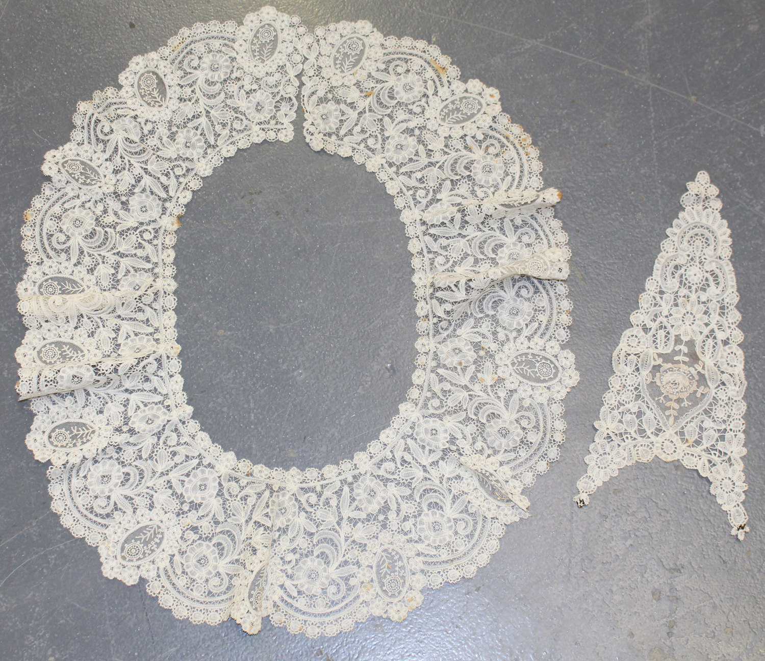 A Brussels Point de Gaze lacework bertha collar, worked with continuous flowerheads and leaves,