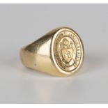 A gold seal ring with an ecclesiastical crest within a Latin motto, ring size approx U.Buyer’s