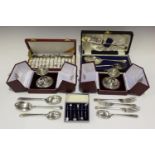 A small group of silver and plated items, including a set of six sterling toothpicks, each with a