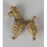 A 9ct gold brooch, modelled as a standing poodle, London 1963, width 2.7cm.Buyer’s Premium 29.4% (